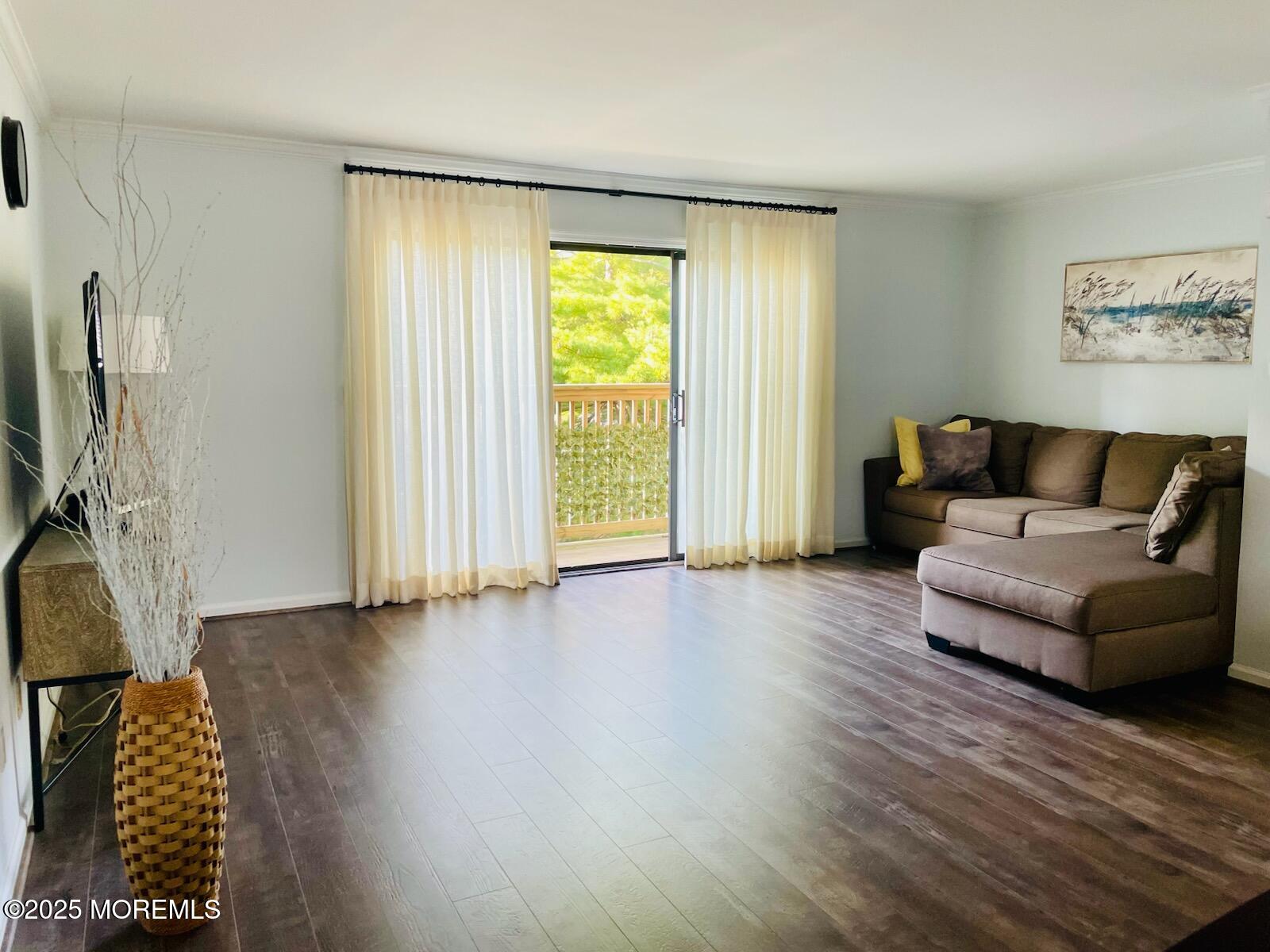 190 Spruce Street, Unit 8 Long Branch, NJ 07740 - Photo 9 of 15 a living room with furniture and a wooden floor