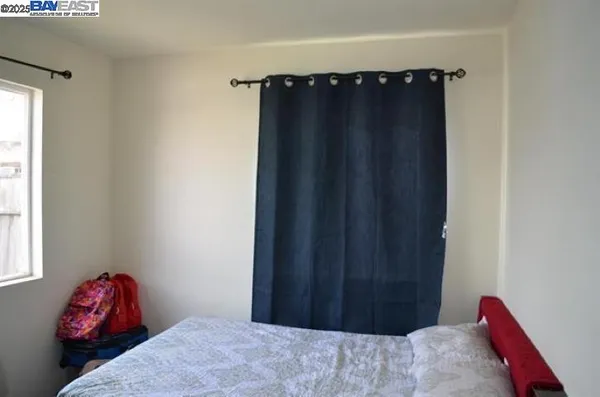 a bedroom with a bed and a closet