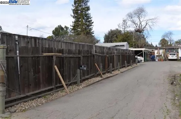 a view of a balcony with wooden fence