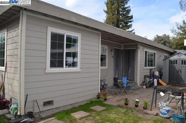 a backyard of a house with seating space