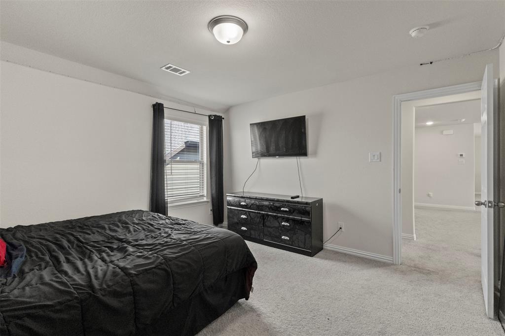 620 Ruthye Lane Pilot Point, TX 76258 - Photo 30 of 39 Bedroom with Ensuite bathroom