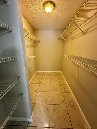 a view of a hallway with washer and dryer