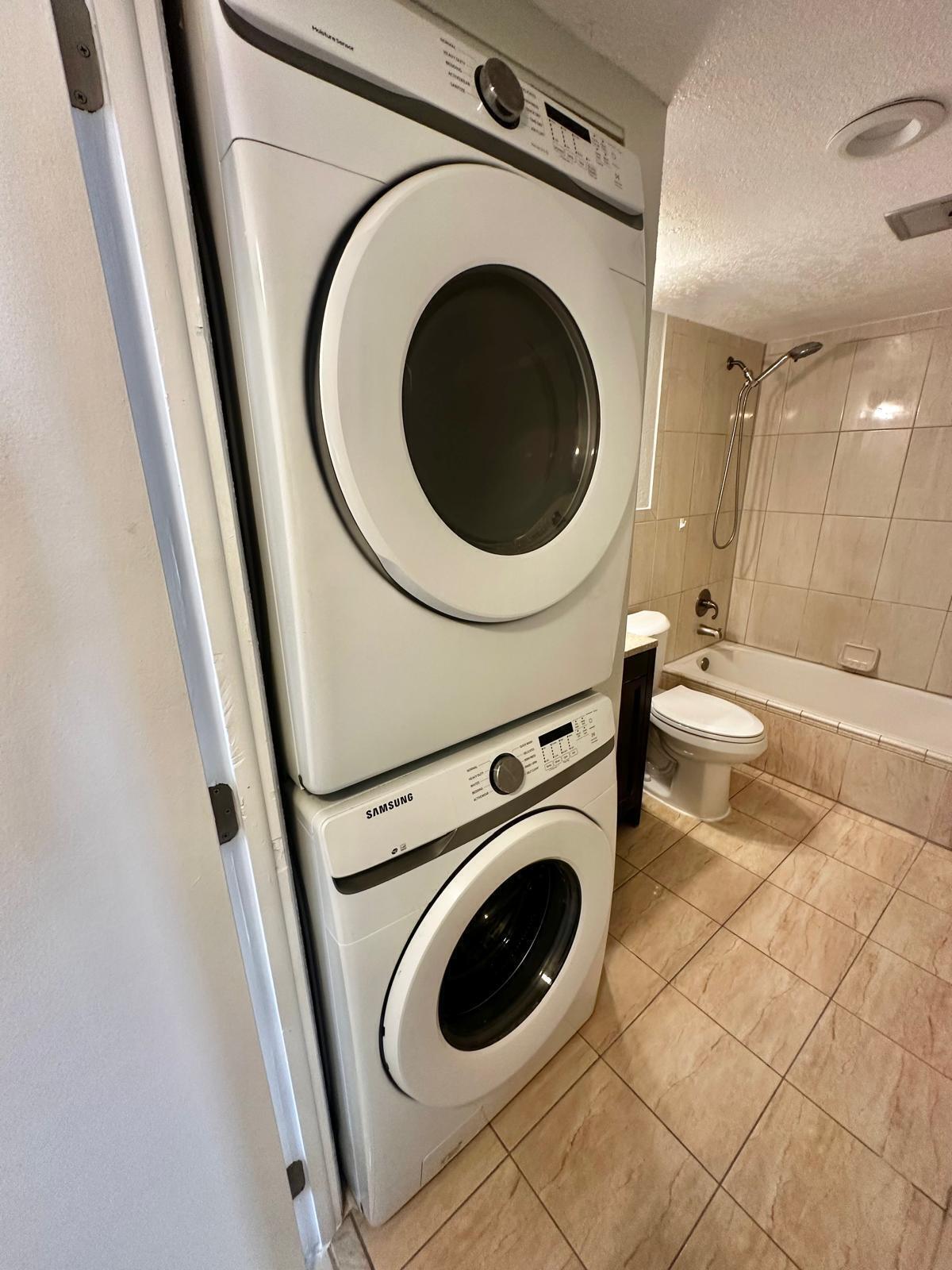 4158 Inverrary Drive, Unit 202 Lauderhill, FL 33319 - Photo 17 of 20 a view of a hallway with washer and dryer