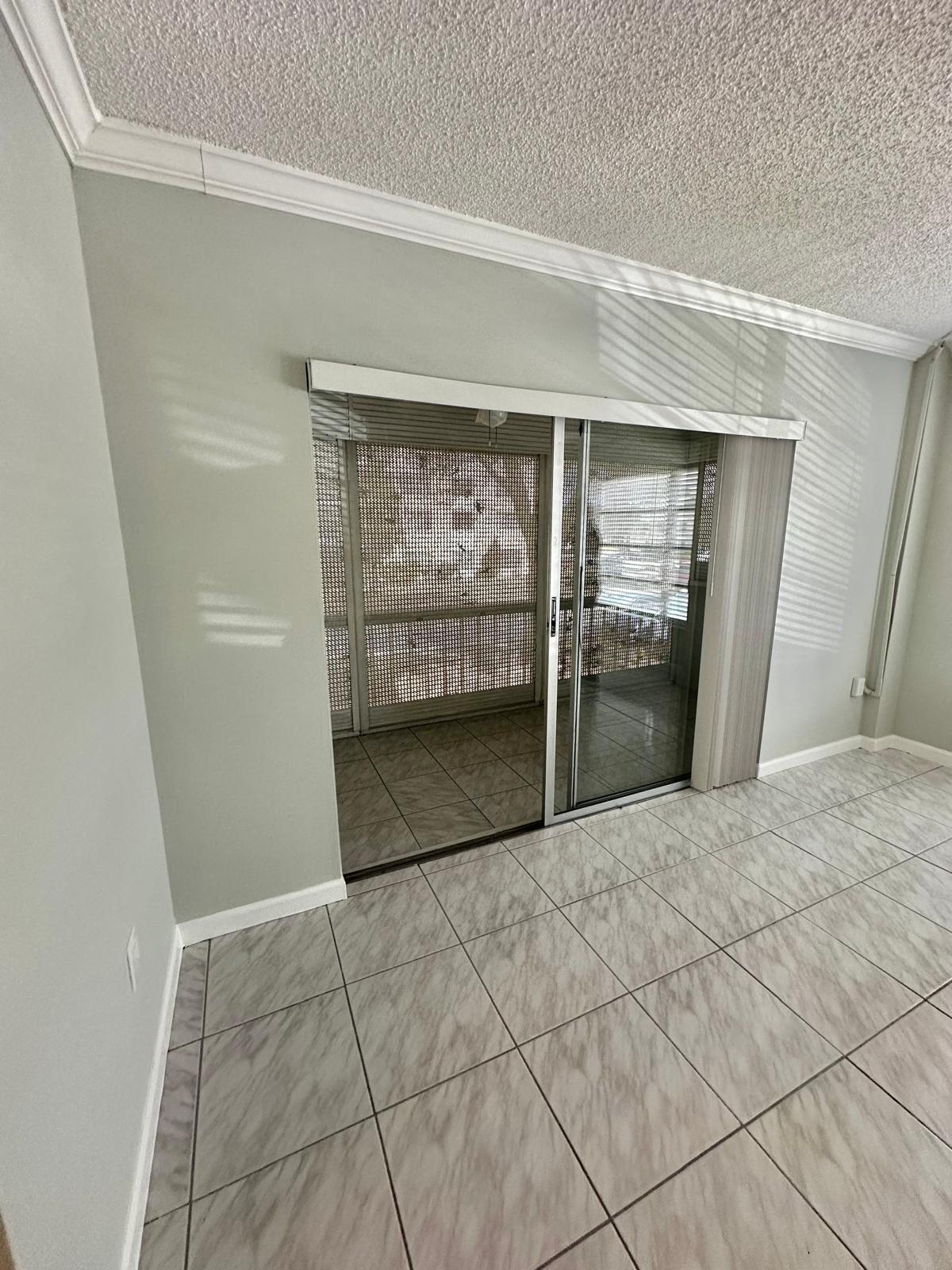 4158 Inverrary Drive, Unit 202 Lauderhill, FL 33319 - Photo 7 of 20 a view of empty room with wooden floor