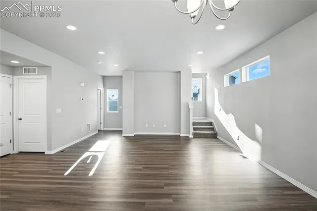 a view of a livingroom with wooden floor