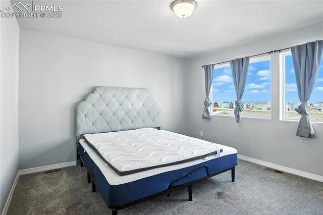 a room with a bed and window