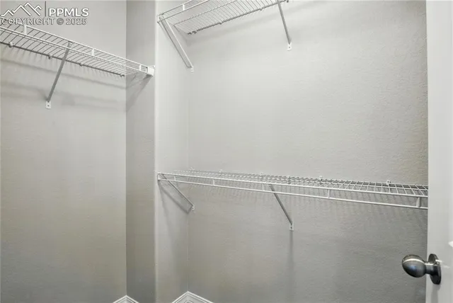 a view of a room with racks on the wall