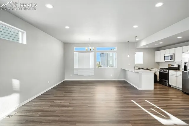 a view of kitchen with wooden floor