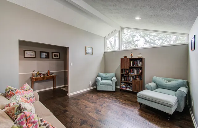 a living room with furniture and a couch