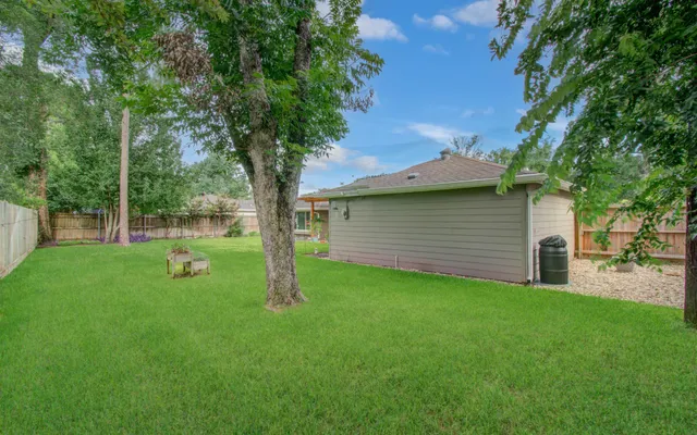 a view of a backyard with a small cabin