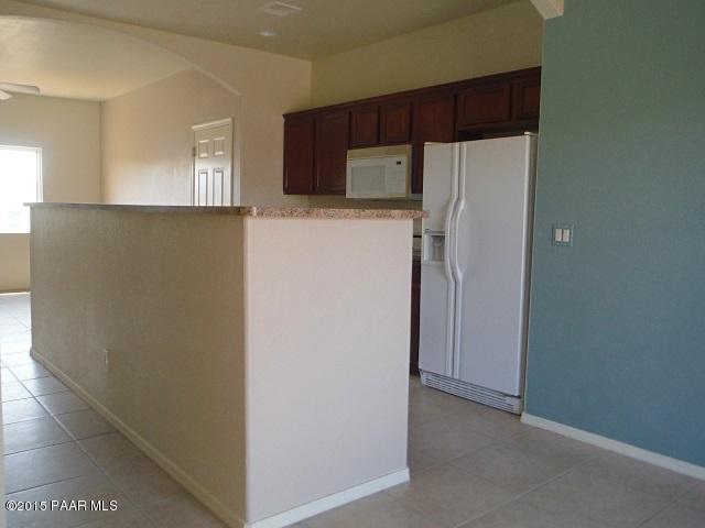4605 North Miller Road Rimrock, AZ 86335 - Photo 5 of 20 a view of a kitchen with a refrigerator cabinets and a refrigerator