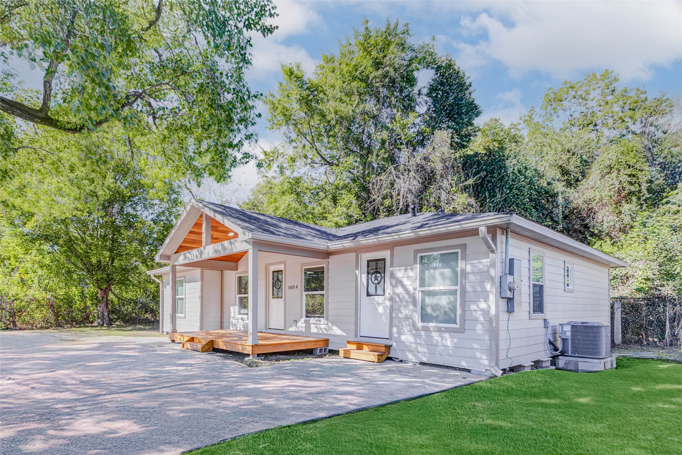a view of a house with garden and yard