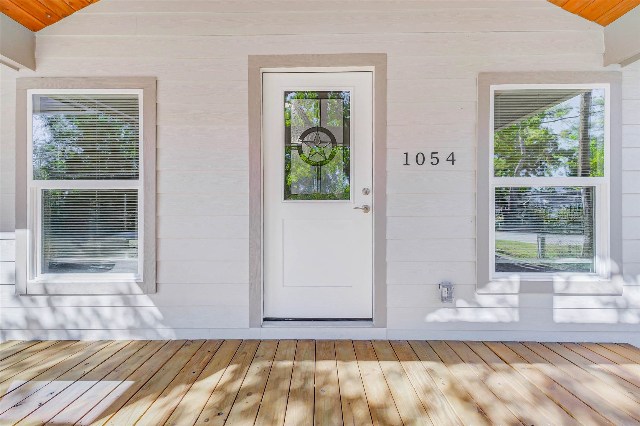 1054 Dewalt Street Houston, TX 77088 - Photo 11 of 24 a view of a room that has a bed and a window