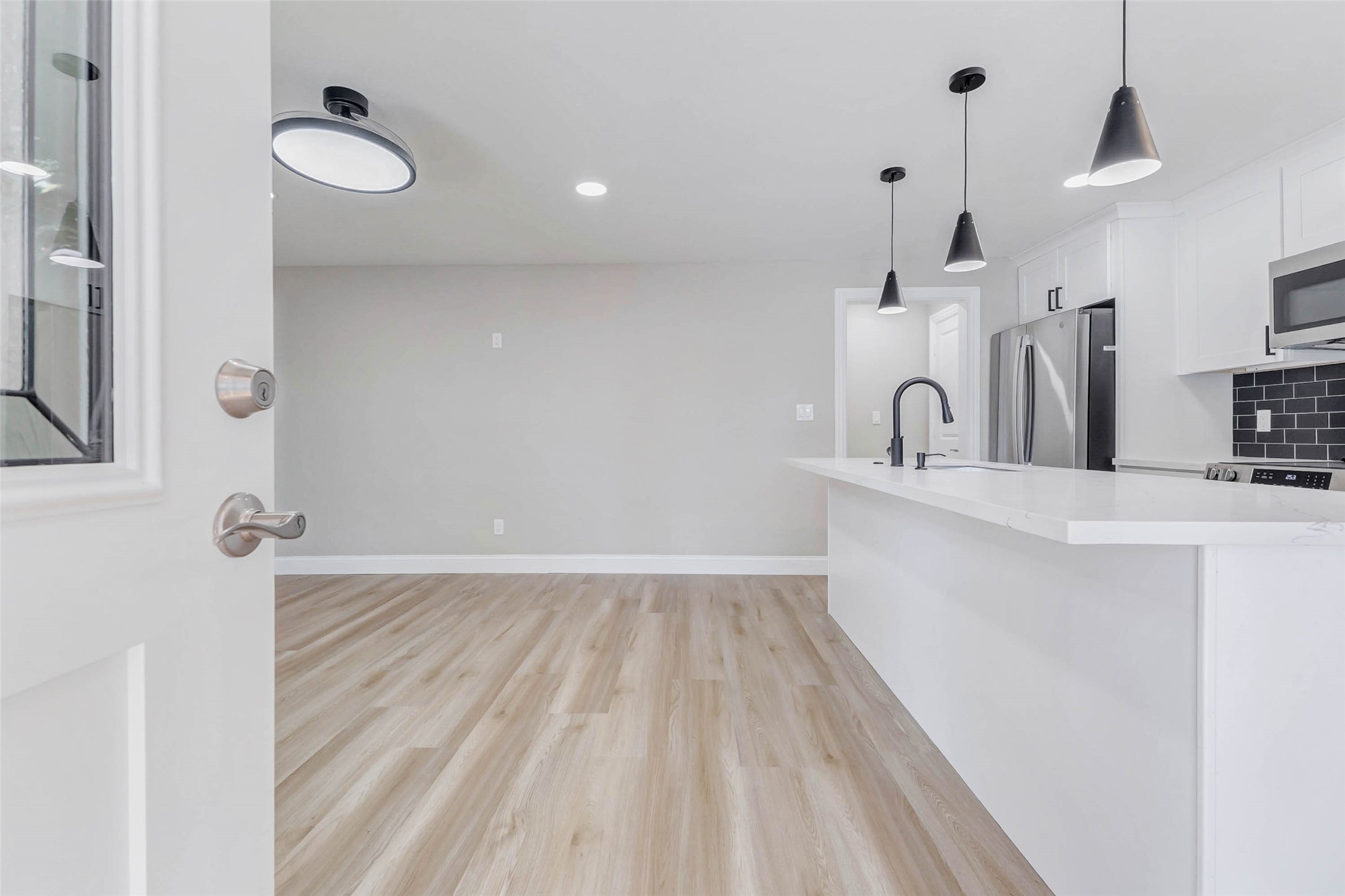 1054 Dewalt Street Houston, TX 77088 - Photo 12 of 24 a kitchen with a sink and a mirror