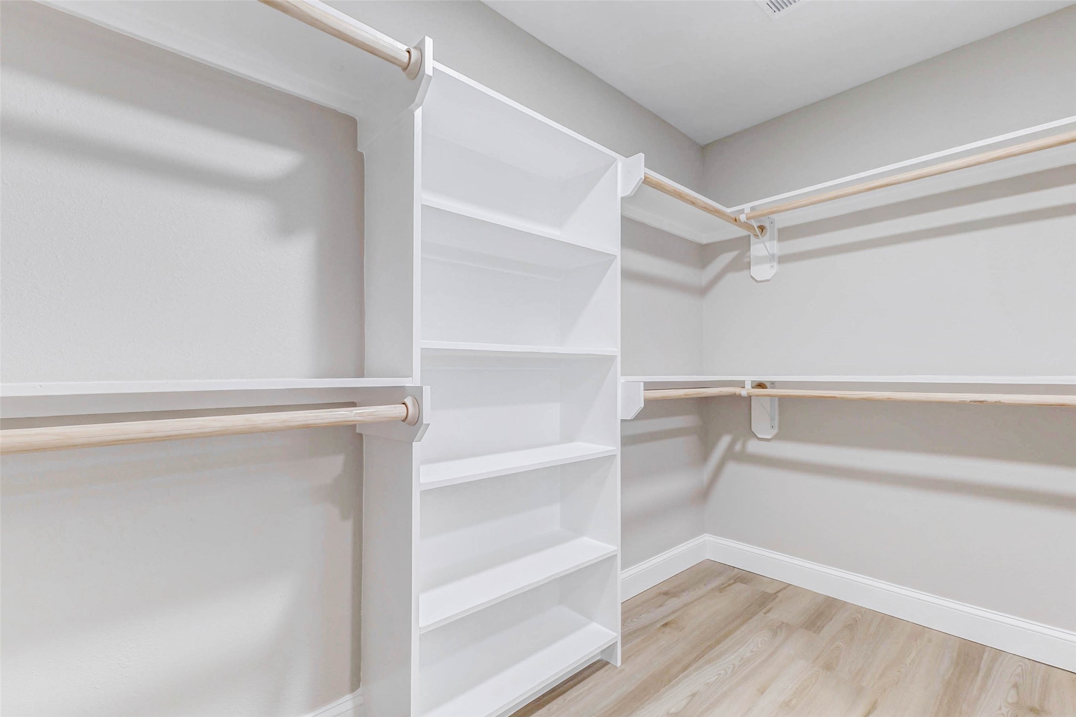 1054 Dewalt Street Houston, TX 77088 - Photo 24 of 24 a view of walk in closet with empty racks