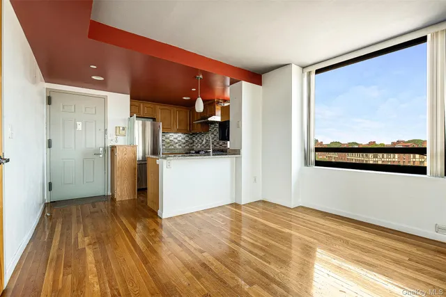 a view of kitchen with furniture and wooden floor