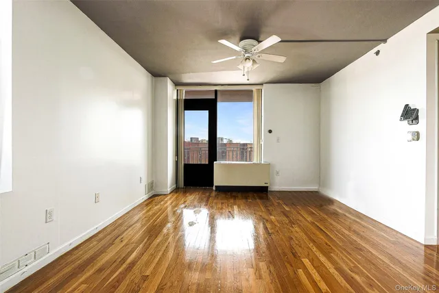 a view of hallway with wooden floor
