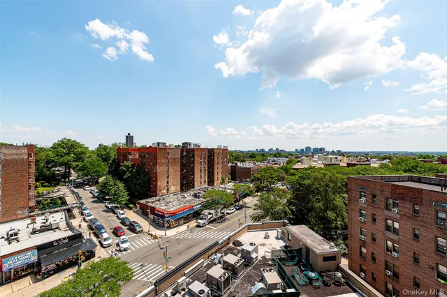 a view of a kitchen with wooden floor and a refrigerator