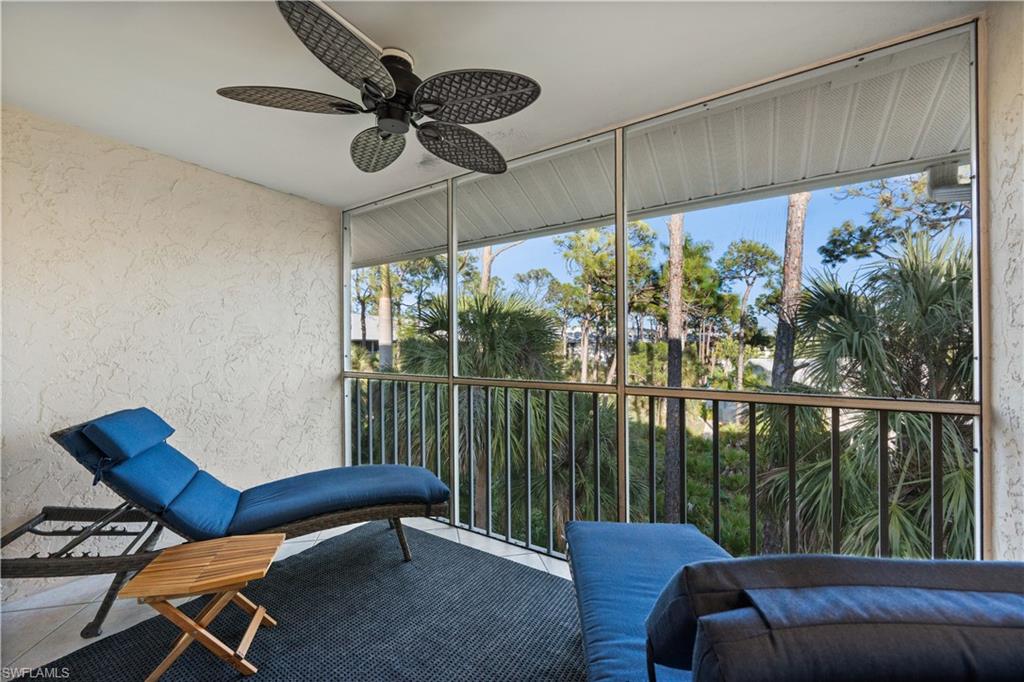 3012 Sandpiper Bay Circle, Unit D302 Naples, FL 34112 - Photo 13 of 16 a balcony with furniture