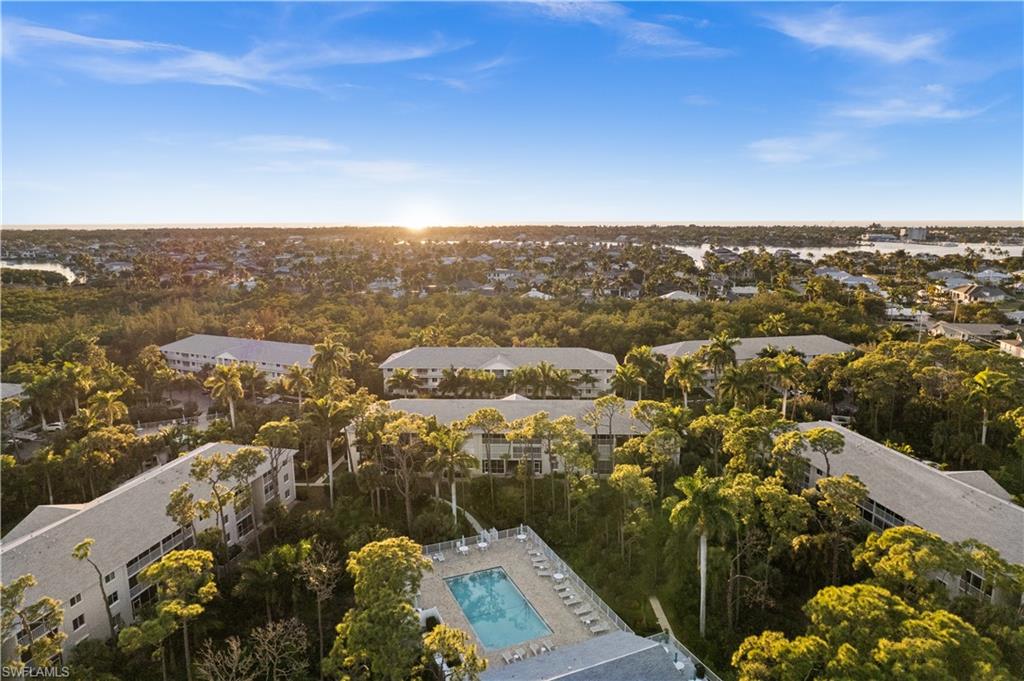 3012 Sandpiper Bay Circle, Unit D302 Naples, FL 34112 - Photo 15 of 16 an aerial view of a residential houses with city view