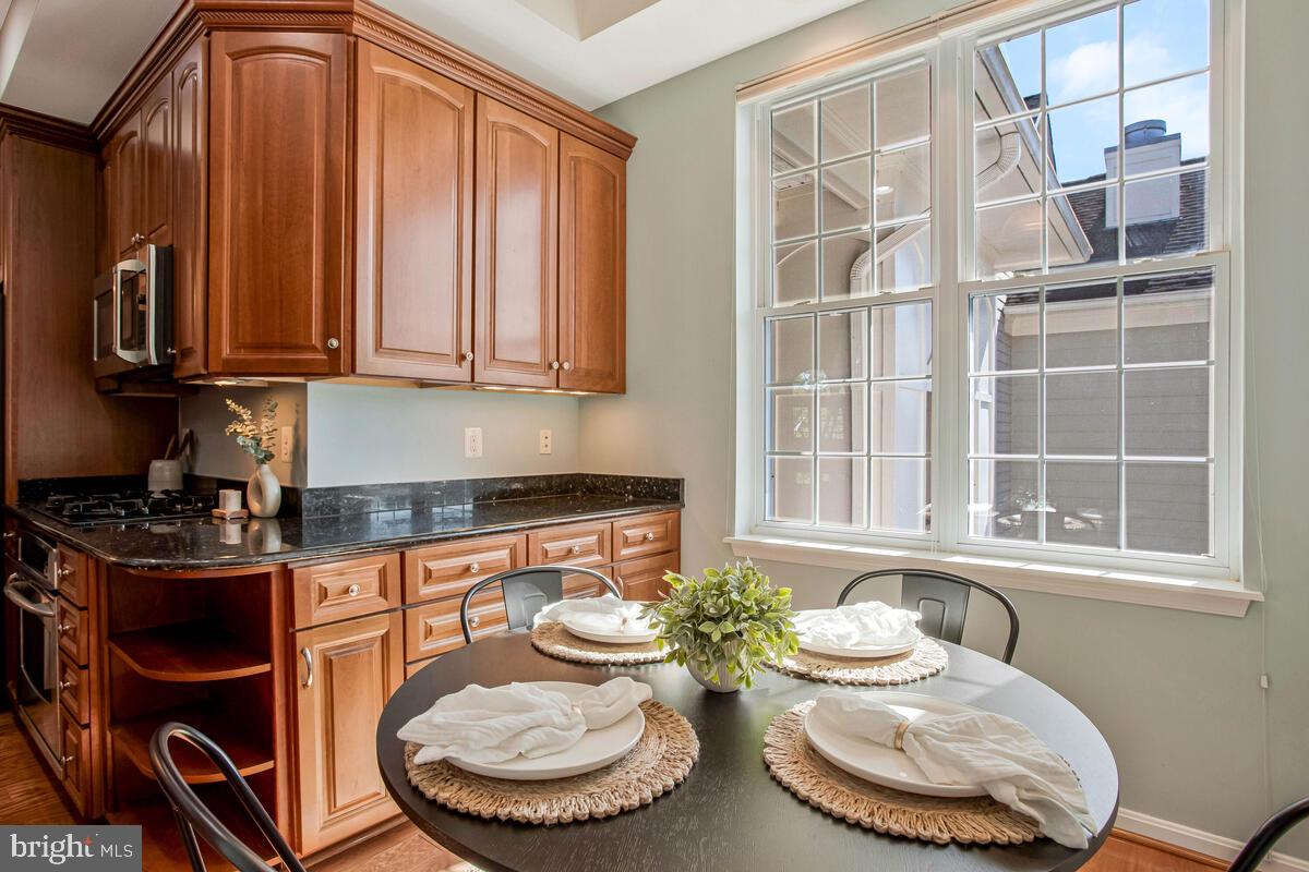 735 Runabout Loop, Unit 735 Solomons, MD 20688 - Photo 10 of 51 a kitchen with a stove and a chair