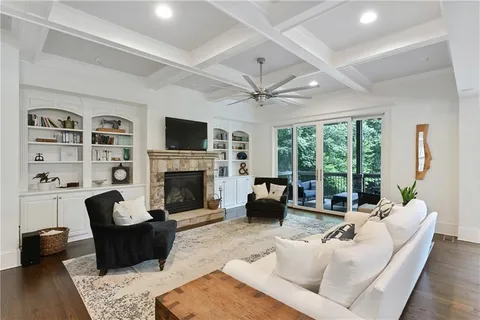 a kitchen with stainless steel appliances kitchen island granite countertop a stove a sink and a microwave