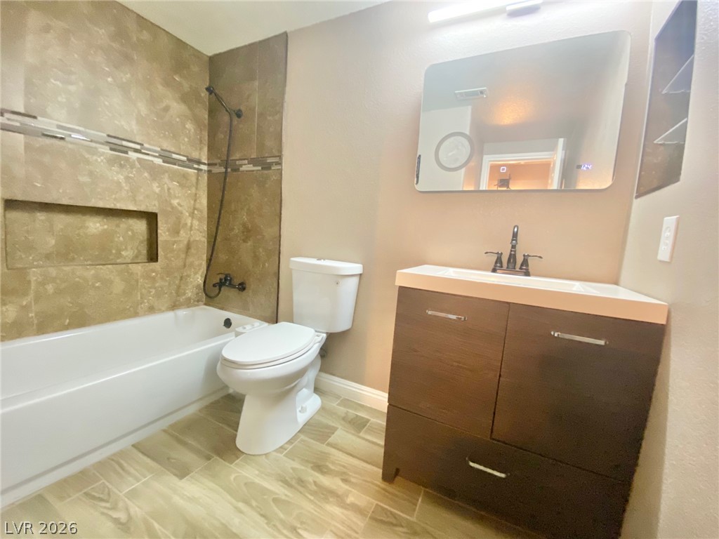 2000 Turquoise Ridge Street, Unit 204 Las Vegas, NV 89117 - Photo 23 of 29 A well-appointed bath features a tiled shower and vanity with contemporary fixtures.