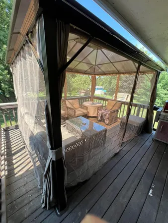 a view of balcony with wooden floor