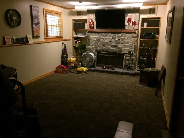 a room with furniture and a fireplace