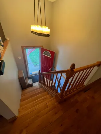 a bedroom with double bed and a window