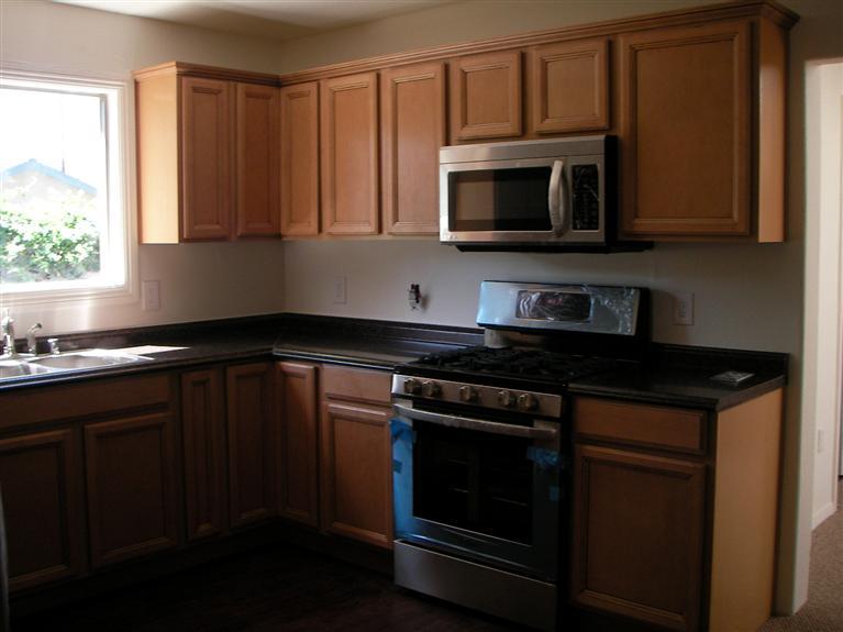 81 Valley Road Oak View, CA 93022 - Photo 3 of 11 a kitchen with stainless steel appliances a stove a microwave sink and cabinets
