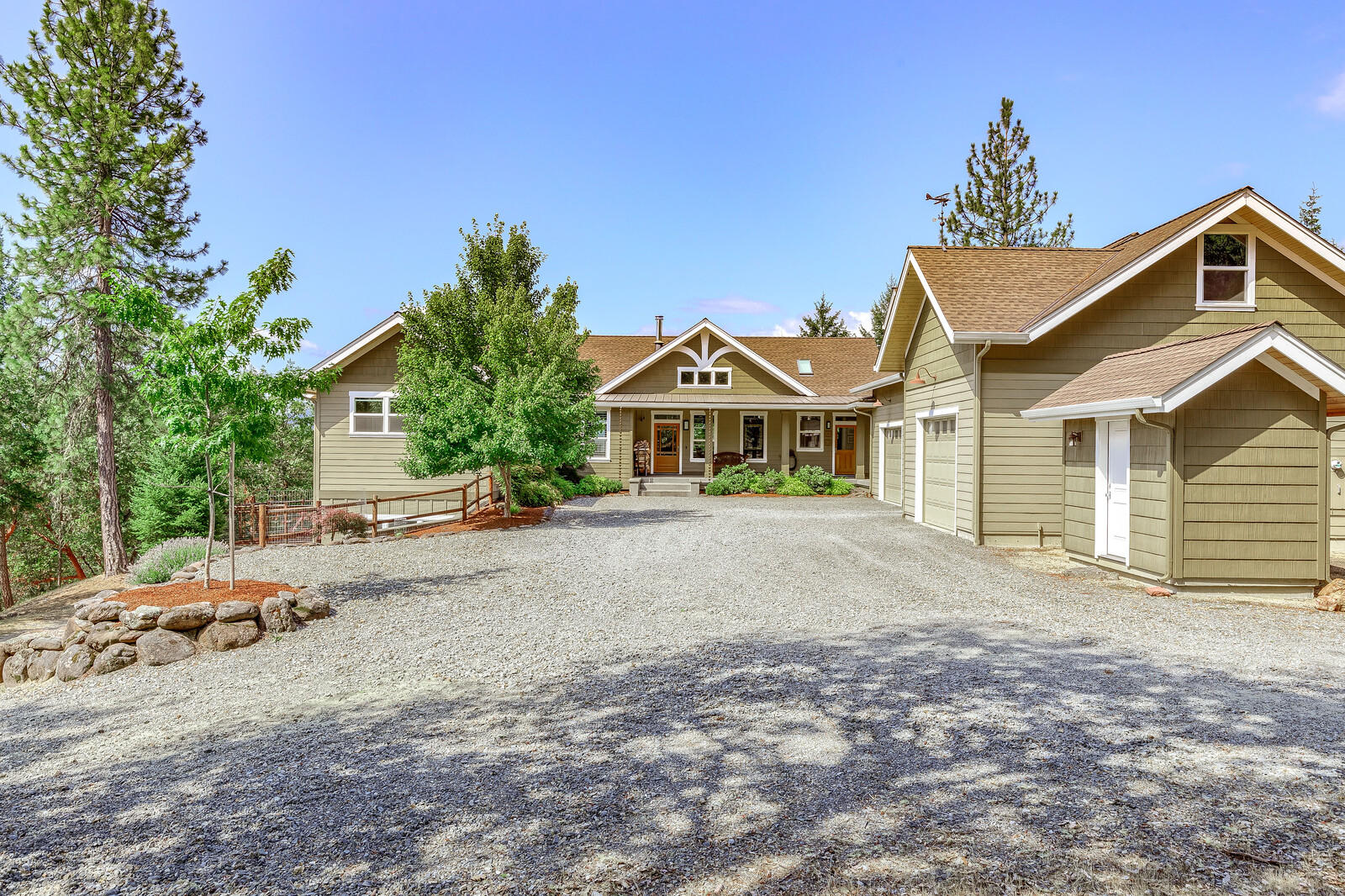 1882 Stewart Road Grants Pass, OR 97526 - Photo 2 of 44 a front view of a house with a yard and garage