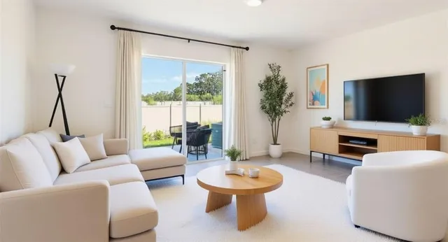 a living room with furniture and a flat screen tv