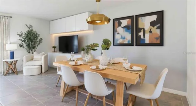 a view of a dining room with furniture wooden floor and a chandelier