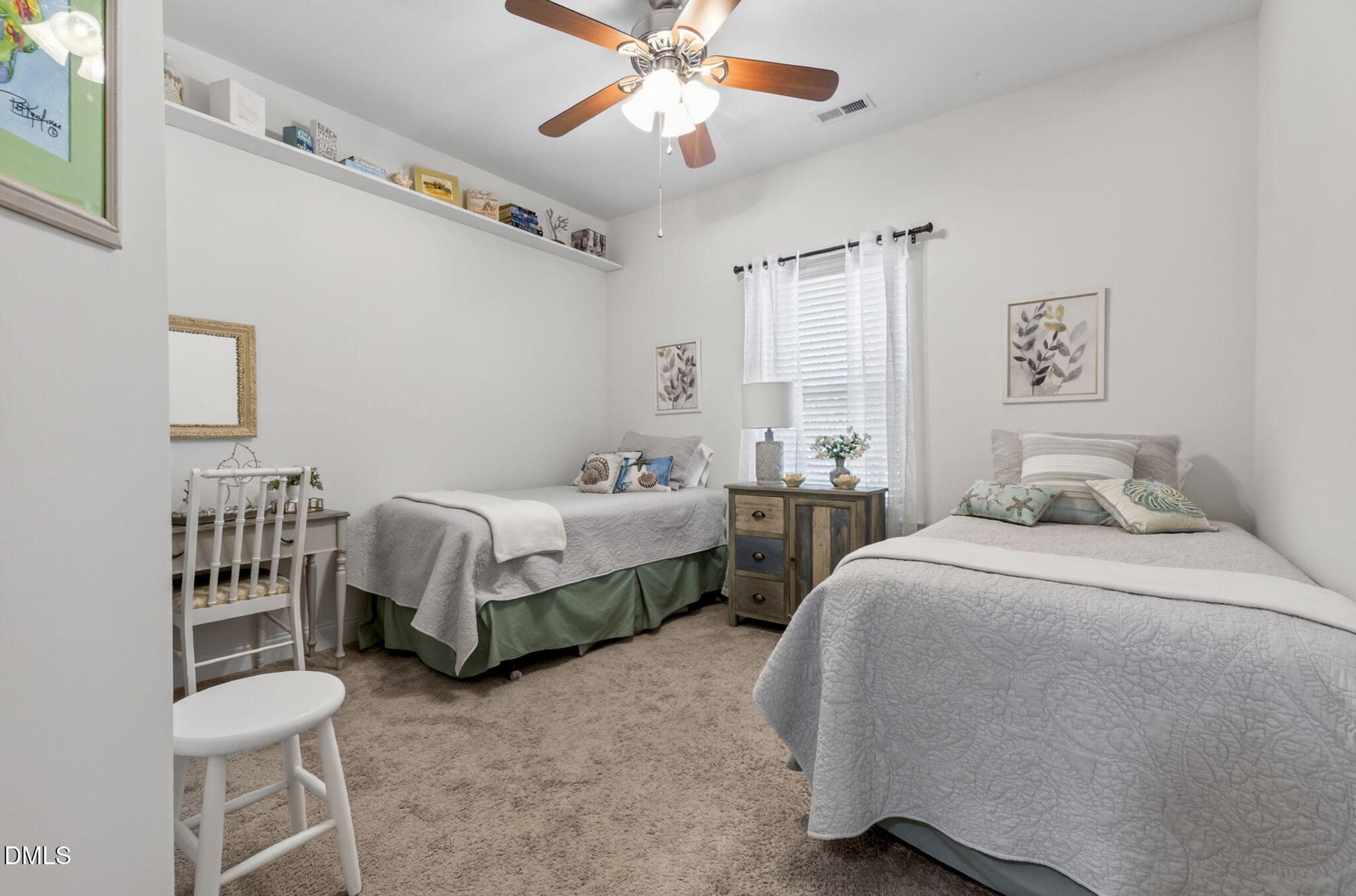 20 Deep Clay Circle Angier, NC 27501 - Photo 38 of 54 a bedroom with a bed and a chandelier