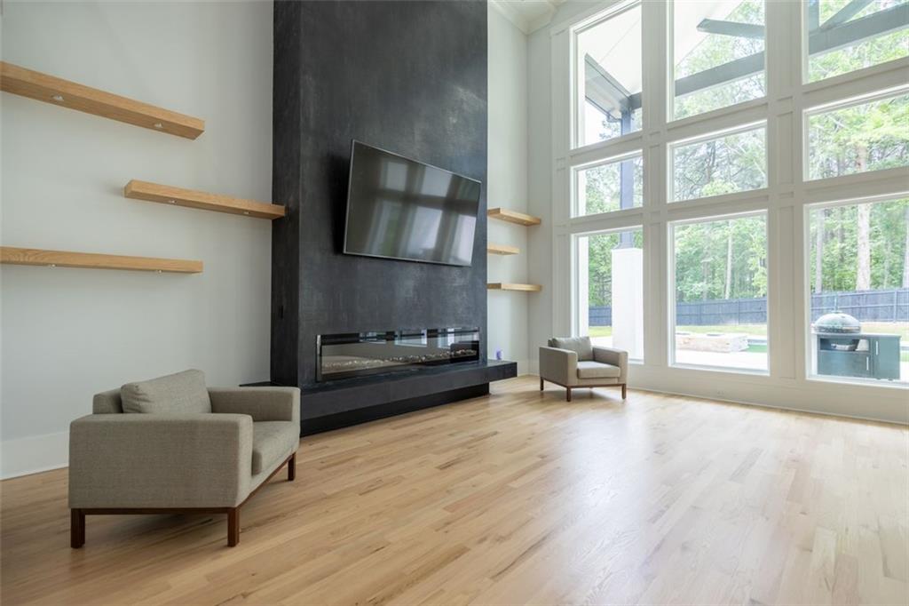 3470 Hamilton Mill Road Buford, GA 30519 - Photo 16 of 39 a living room with furniture and a fireplace