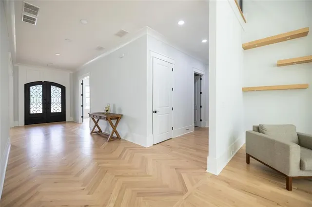 a view of livingroom with dining room and couches with wooden floor