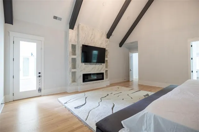 a living room with fireplace furniture and a flat screen tv