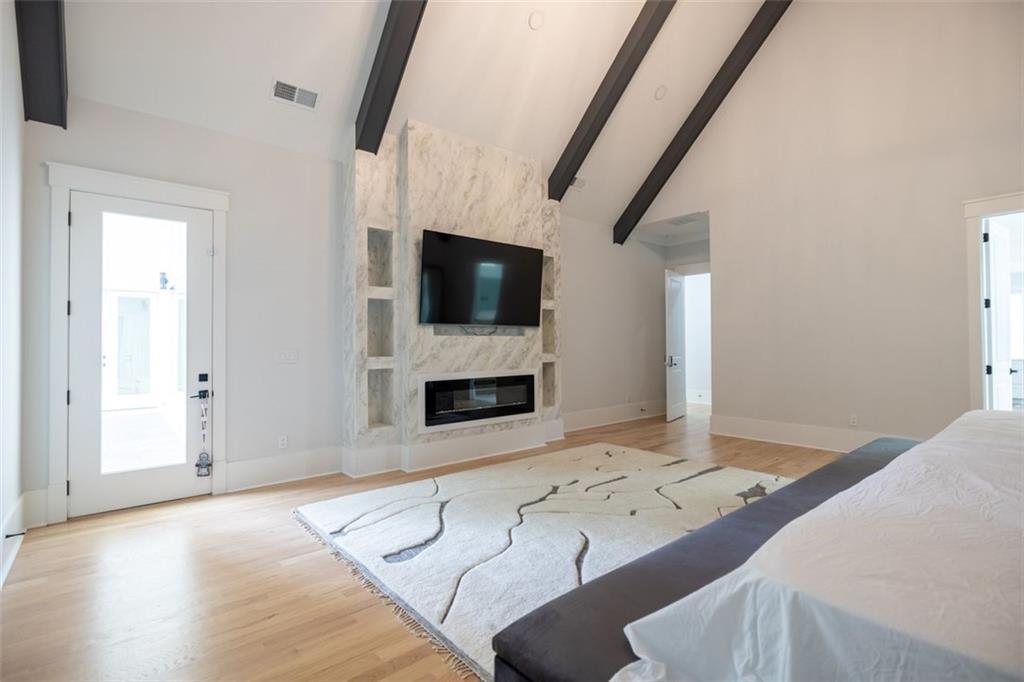 3470 Hamilton Mill Road Buford, GA 30519 - Photo 28 of 39 a living room with fireplace furniture and a flat screen tv