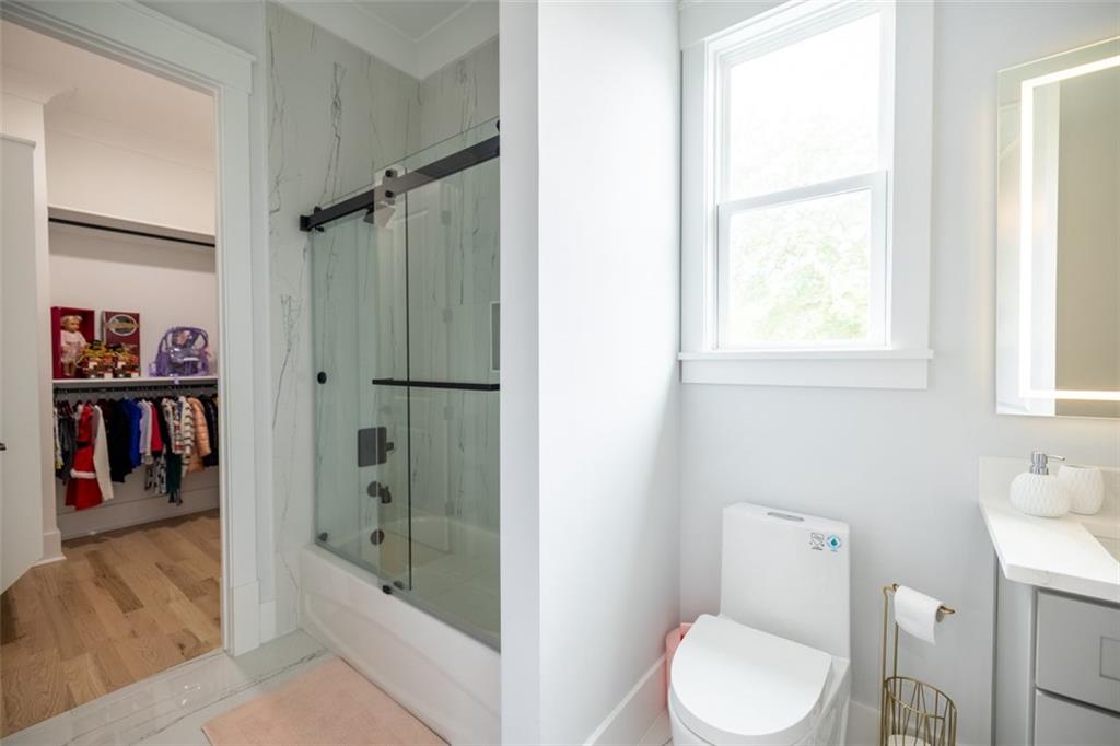 3470 Hamilton Mill Road Buford, GA 30519 - Photo 33 of 39 a bathroom with a toilet and a shower