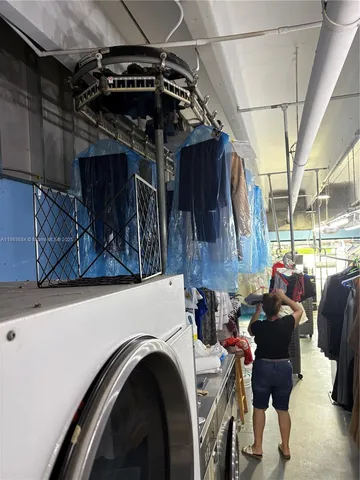 a room with lots of furniture and a large window