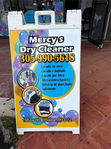 a view of a kitchen with appliances and cabinets