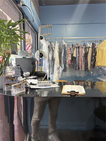 a kitchen with a sink a stove and cabinets