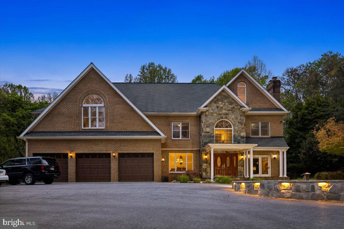 13120 Esworthy Road Potomac, MD 20854 - Photo 2 of 83 Serene lighting illuminates this home at twilight