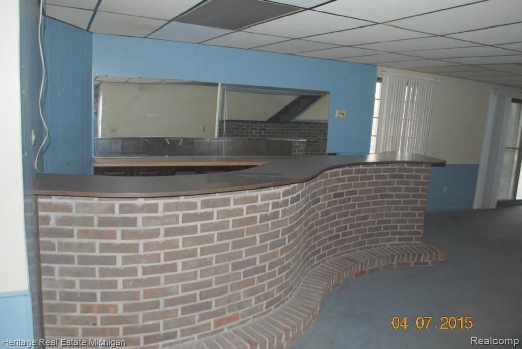63 Endicott Howell, MI 48843 - Photo 7 of 39 basement bar