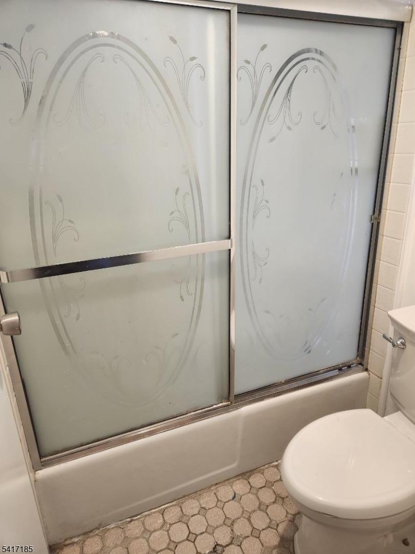 365 River Road, Unit E Nutley, NJ 07110 - Photo 11 of 14 a bathroom with a toilet and a shower