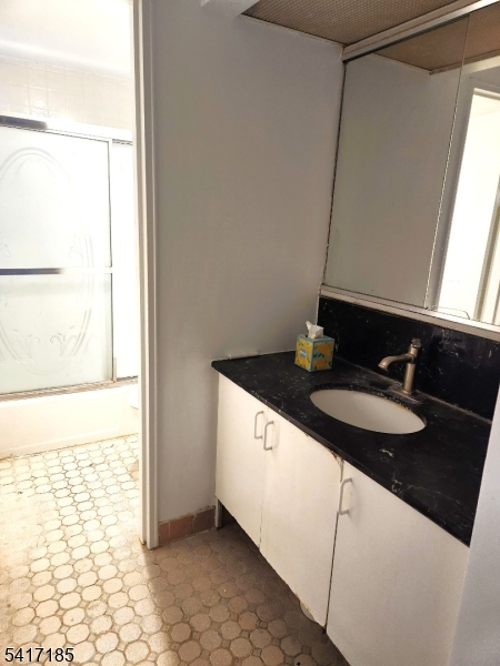 365 River Road, Unit E Nutley, NJ 07110 - Photo 12 of 14 a bathroom with a sink and a mirror