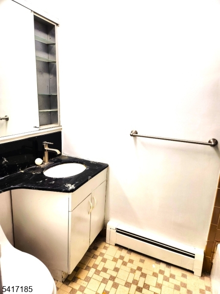 365 River Road, Unit E Nutley, NJ 07110 - Photo 13 of 14 a bathroom with a sink and a mirror