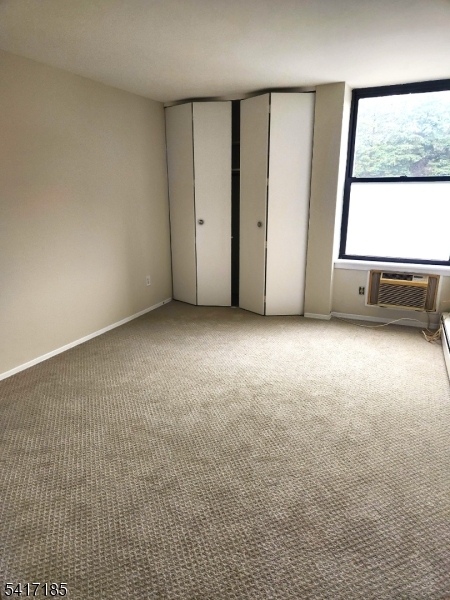 365 River Road, Unit E Nutley, NJ 07110 - Photo 6 of 14 an empty room with windows