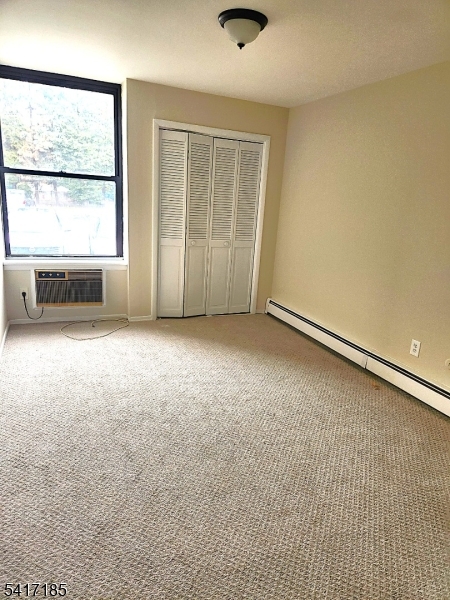 365 River Road, Unit E Nutley, NJ 07110 - Photo 7 of 14 an empty room with windows
